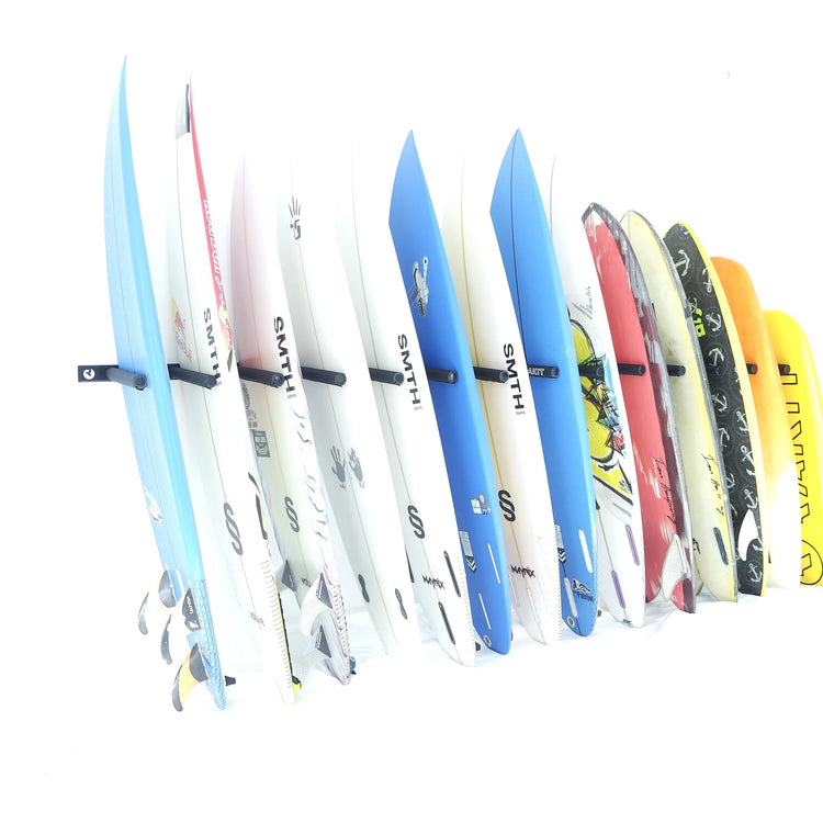 Board Room Surf Rack - Rakit Systems Wall mounted board rack with seven board capacity. Laser cut aluminium chassis, powder coated black for durability. CNC machined aluminium supports. Nylon/EVA foam covers for protection. Installation hardware and drill bit included. Store 7 boards horizontally or 14 vertically. Full 2 year guarantee. Board storage becomes simple, easy and safe.